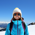 **

A snowboarder on a sunny mountain, wearing a shell jacket, fleece, and a light base layer. They are wearing sunglasses and a hat. The sky is bright blue, and there's a groomed slope behind them. Focus on the layering and the happy, comfortable expression of the snowboarder.

**